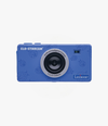 The ELO-STARCAM is a blue digital camera designed for children. It features artificial intelligence technology and is adorned with playful patterns. This product is aimed at young users, perfect for exploring photography. Its apparent features include a quality lens and an ergonomic design for easy handling.